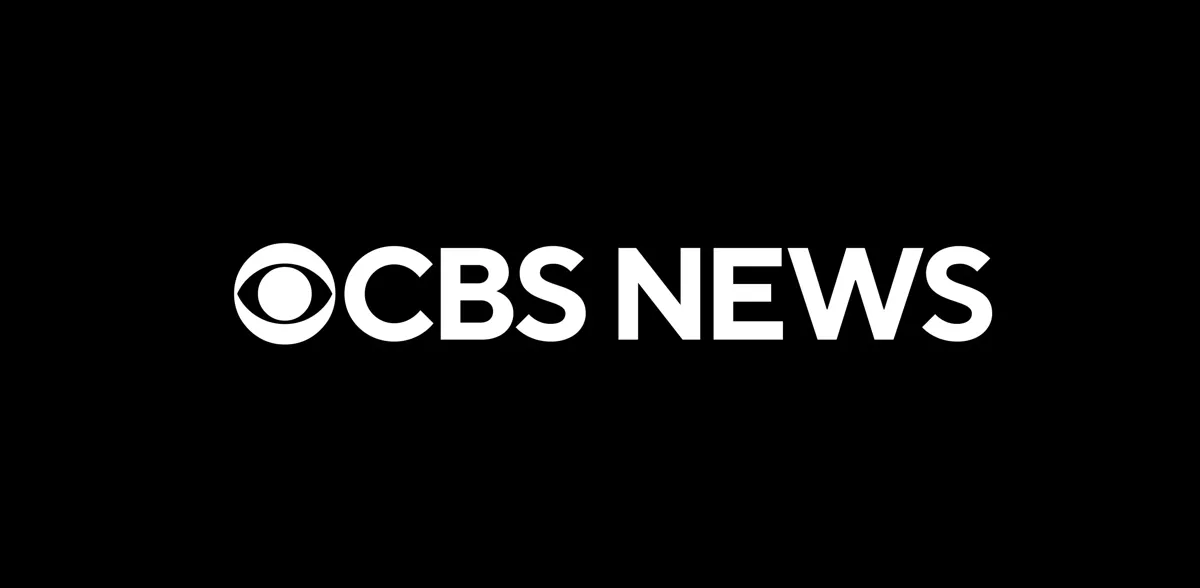 Logotypen för CBS News i vitt mot en svart bakgrund.