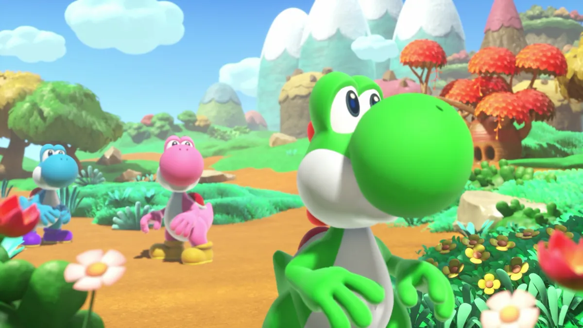 Bilden visar tre Yoshis i ett färgglatt landskap med blommor och berg. En grön Yoshi i förgrunden.