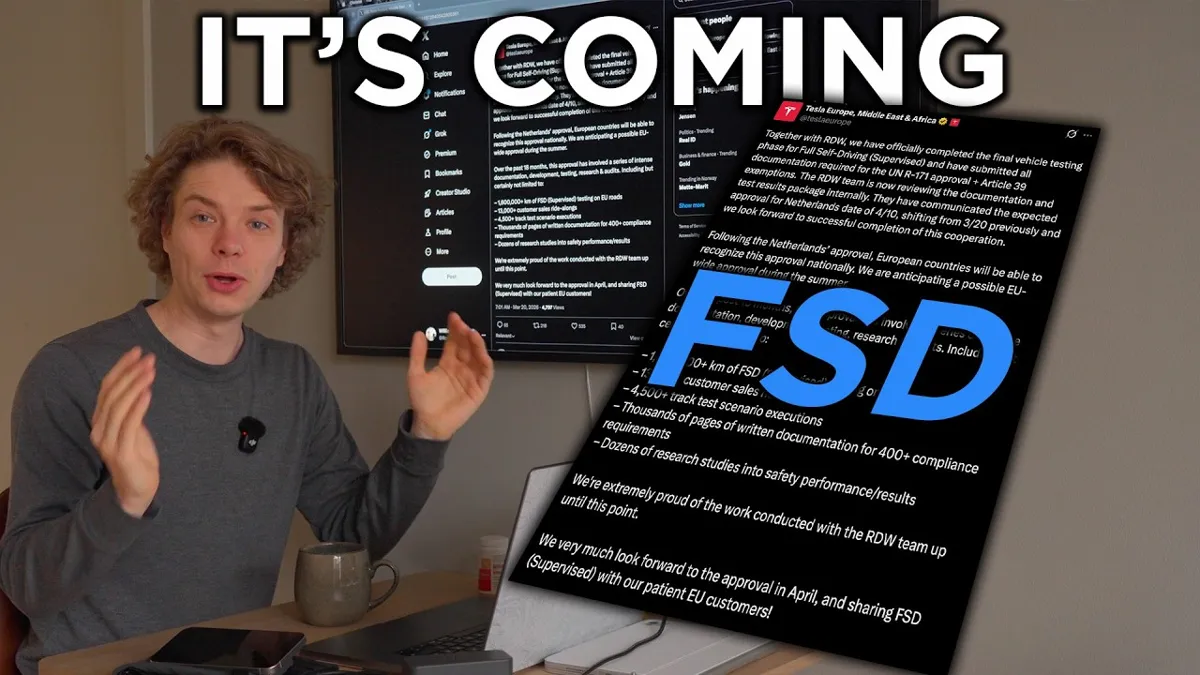 En man sitter vid ett skrivbord med en dator och en mugg. Bakom honom syns en skärm med texten "IT'S COMING" och en tweet om Teslas självkörande mjukvara.